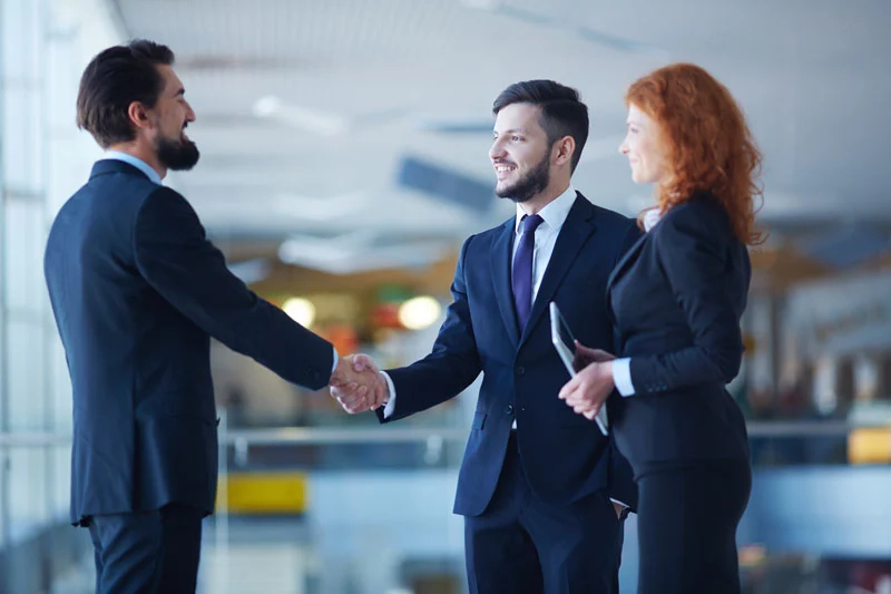 two men and a woman in suits